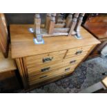 An Edwardian satinwood chest of drawers