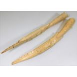 A pair of c.1900 carved ivory tusks with crocodile