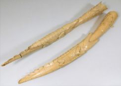 A pair of c.1900 carved ivory tusks with crocodile