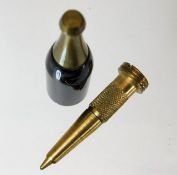 A trench art style brass novelty bottle as pen