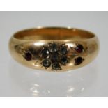 A 9ct gold ring set with red & white paste stones