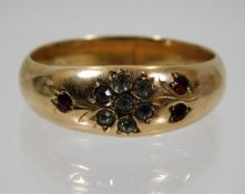 A 9ct gold ring set with red & white paste stones