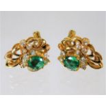 A pair of 14ct gold earrings set with diamonds & S