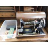 A Singer sewing machine with accessories