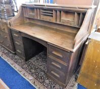 A large c.1900 oak roll top desk 60in wide x 49.5i