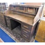 A large c.1900 oak roll top desk 60in wide x 49.5i