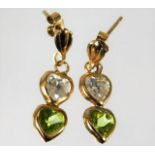 A pair of 9ct gold peridot & white stone earrings