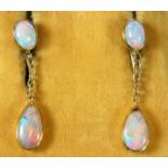 A pair of early 20thC. yellow metal opal earrings