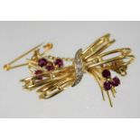 An 18ct gold brooch set with diamond & ruby 7g