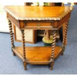 An oak hall table with barley twist decor