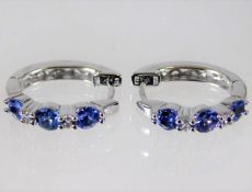 A pair of 14ct white gold diamond & tanzanite hoop