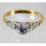 An 18ct gold ring set with 0.56ct main diamond 2.6