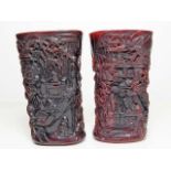 A pair of Chinese ox horn style carved brush pots