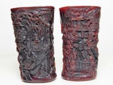 A pair of Chinese ox horn style carved brush pots