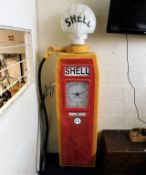 A vintage reproduction Shell petrol pump with glas