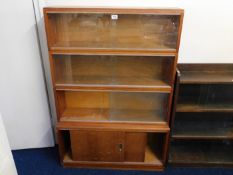 A retro glass sectional bookcase & cupboard below