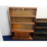 A retro glass sectional bookcase & cupboard below