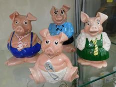 Four Wade ceramic pigs