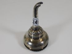 A decorative silver plated wine funnel