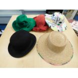 A bowler hat & two other hats