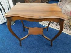 A mahogany two tier table