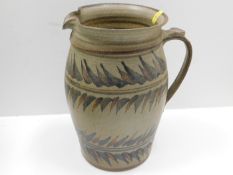 A large studio pottery jug 10in tall