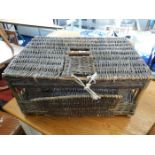 A large vintage wicker pigeon basket