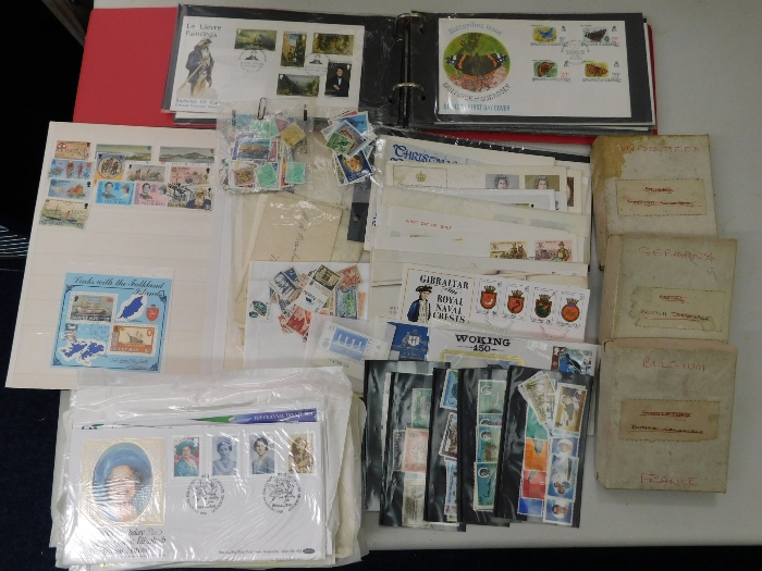 A quantity of loose stamps, first day covers & a w