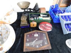 A set of kitchen scales with weights, clocks & oth