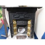 A Victorian cast iron fire place with grate