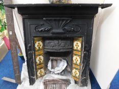 A Victorian cast iron fire place with grate