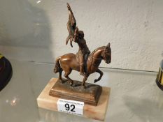 A small mounted bronze model of Joan Of Arc on hor