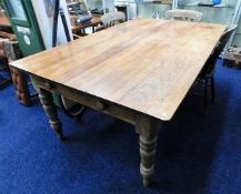 A large 19thC. pine farmhouse table with two drawe