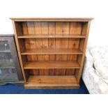 An oak bookcase with three shelves