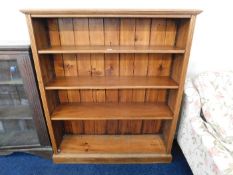 An oak bookcase with three shelves