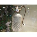 A silver plated topped claret jug