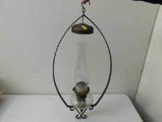 A hanging paraffin lamp
