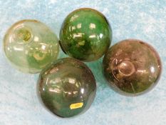 Four green glass fishing floats