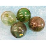 Four green glass fishing floats