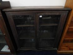 An oak two door bookcase