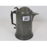 A 19thC. lidded pewter pitcher