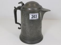 A 19thC. lidded pewter pitcher