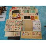 A quantity of stamps, match box covers & other ite