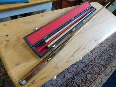 Two snooker cues, one case