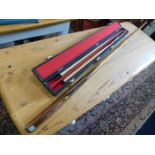 Two snooker cues, one case