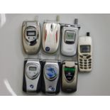 A quantity of six novelty flip phone lighters & one other