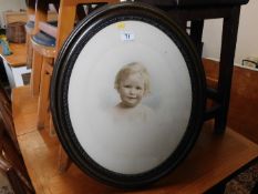 A framed picture of a child