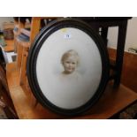 A framed picture of a child