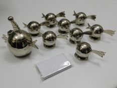 A set of eight bird style plated menu holders with