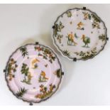 A pair of French Moustiers 18thC. faience plates 9.25in diameter decorated with fantastical animals